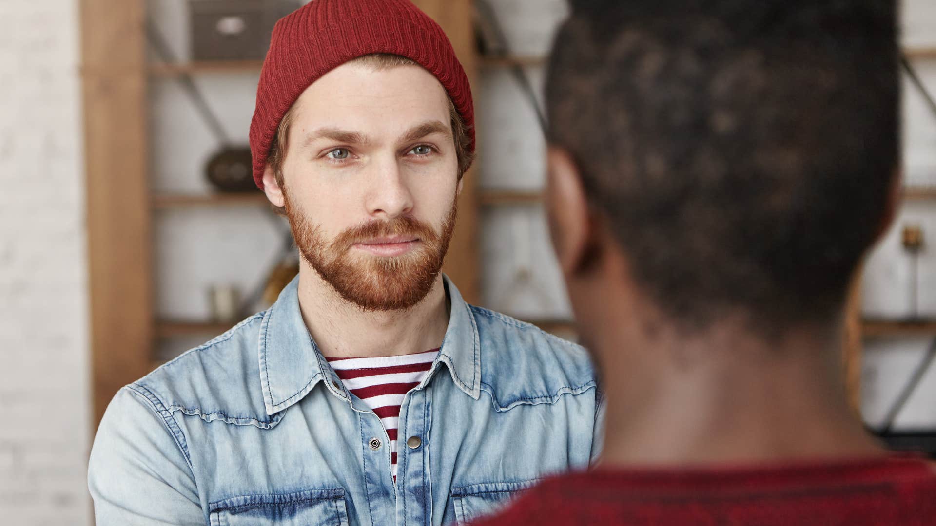 man leading with his values while talking to friend