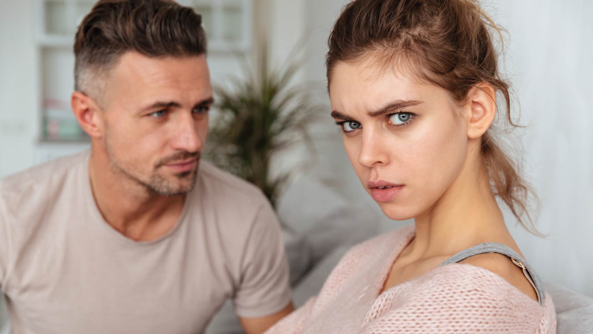 woman turned away from disrespectful man refusing to apologize