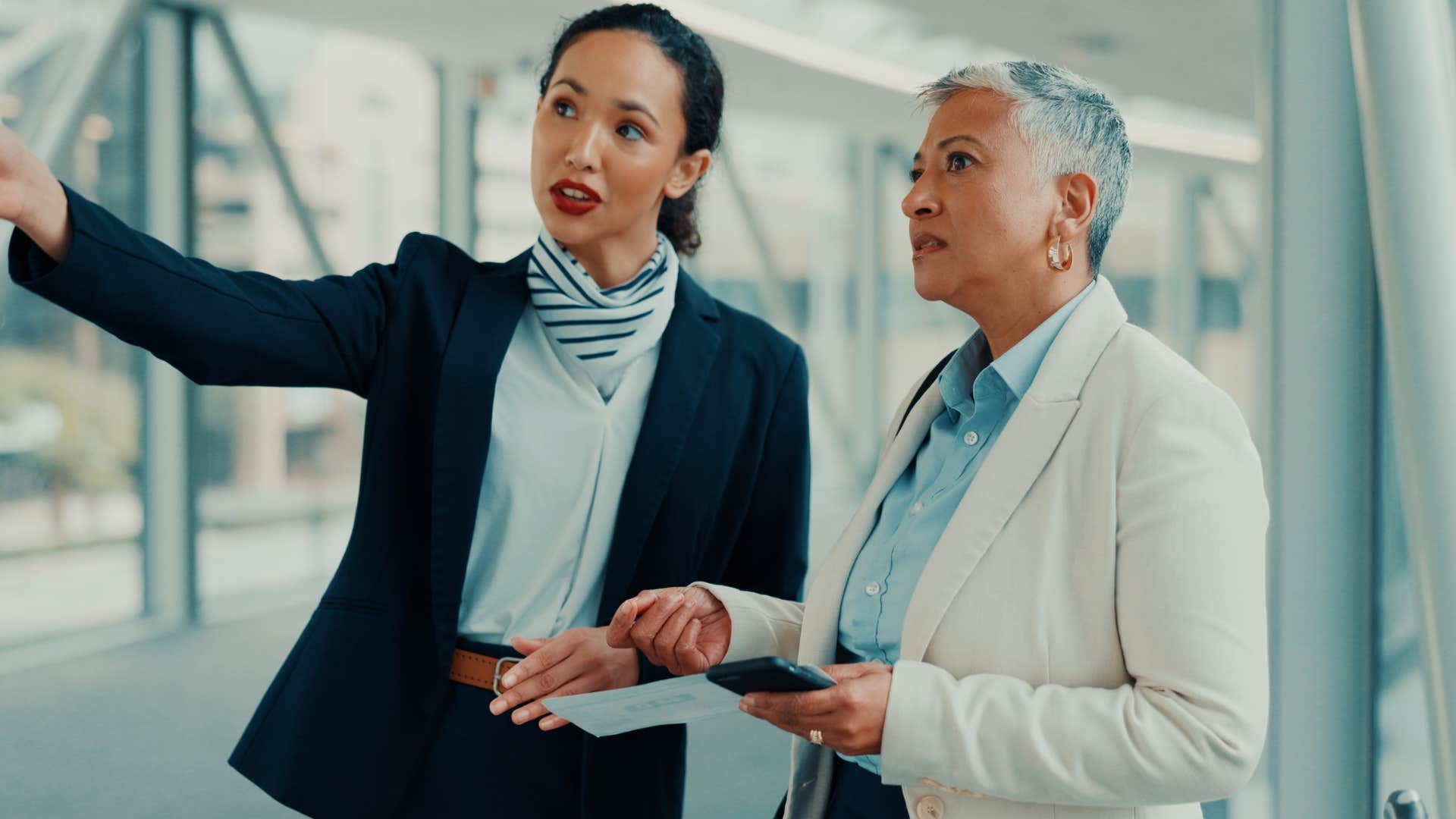 emotionally regulated woman talking at work to colleague