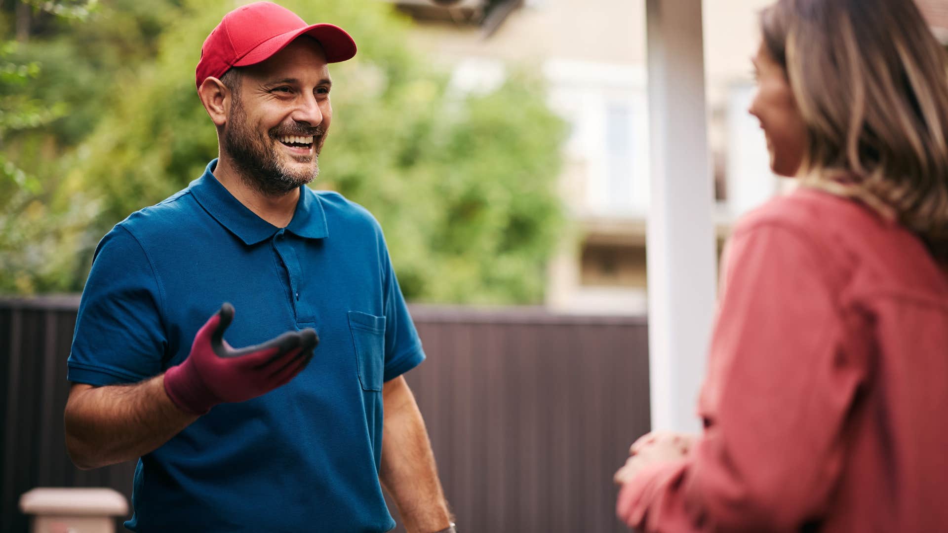 patient service worker speaking with a woman outside