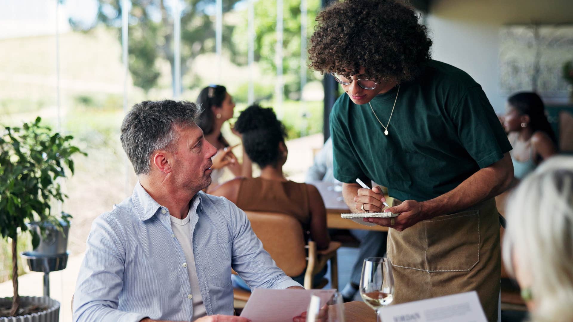 service worker reading customer's body language well while ordering
