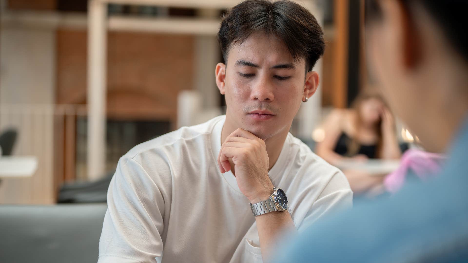 Man saying "I knew it wouldn't work" to a friend.