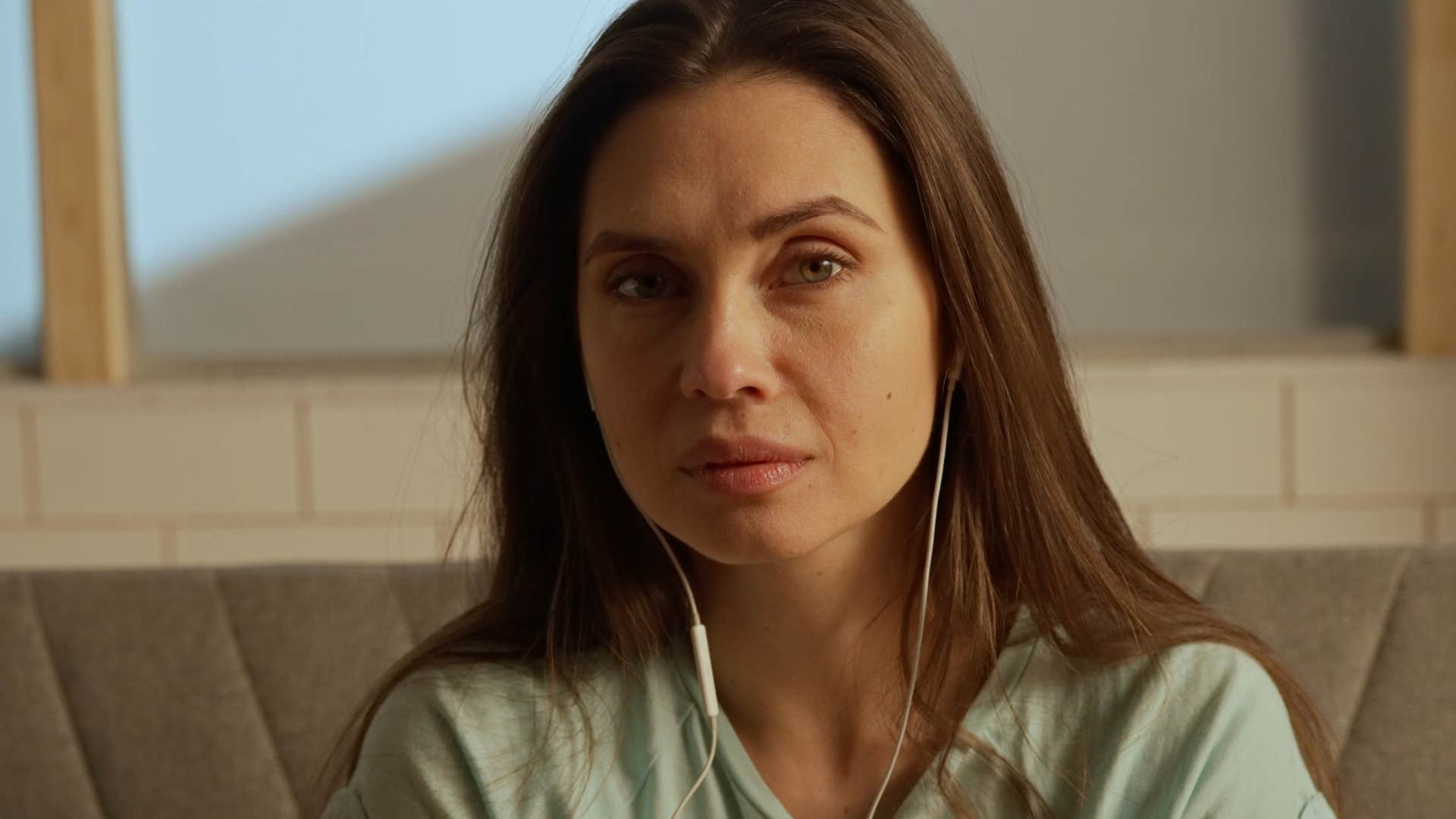 Woman saying "I knew something bad was going to happen" at home.