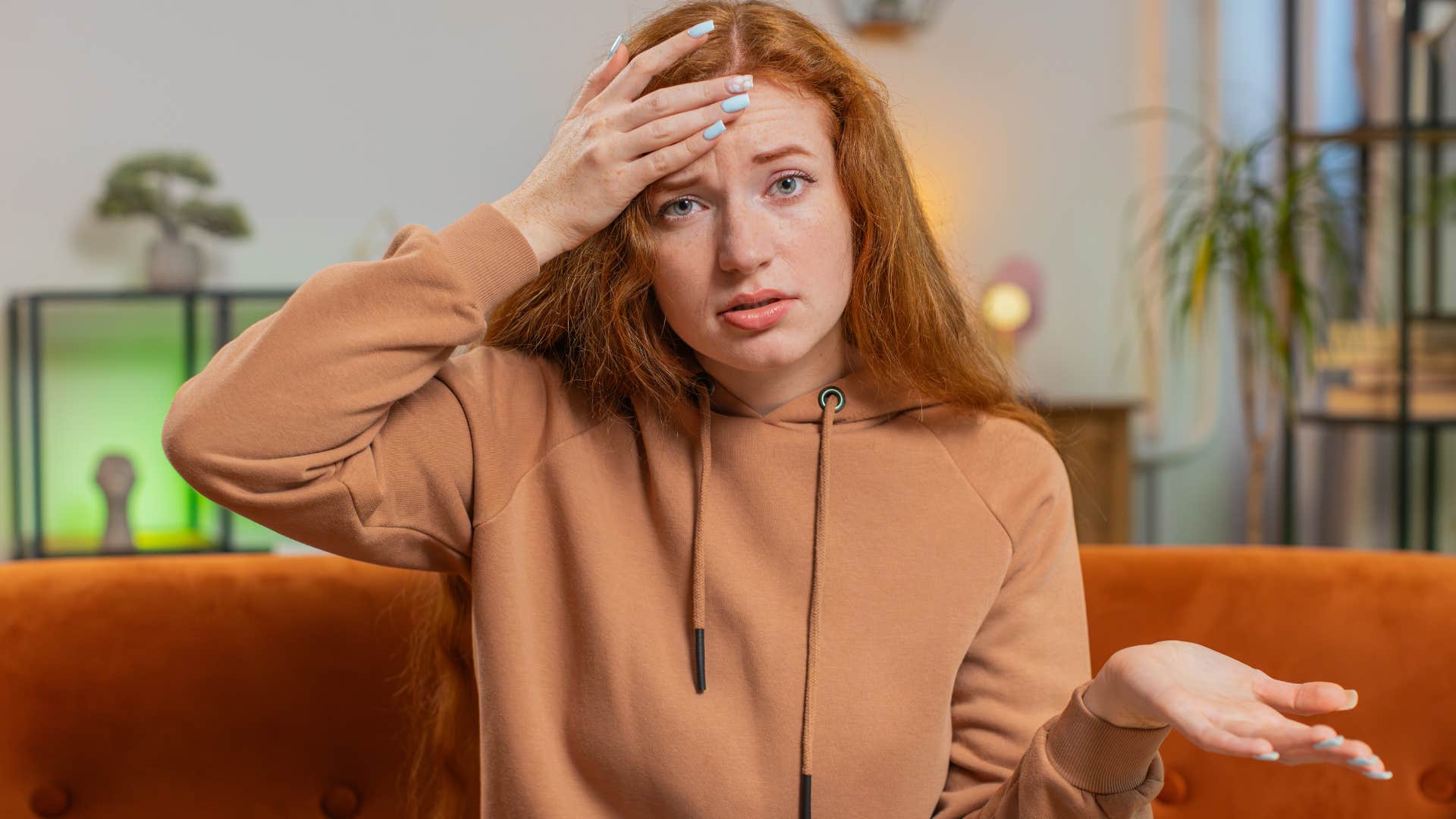 Woman saying "I'm not smart enough for that" at home.