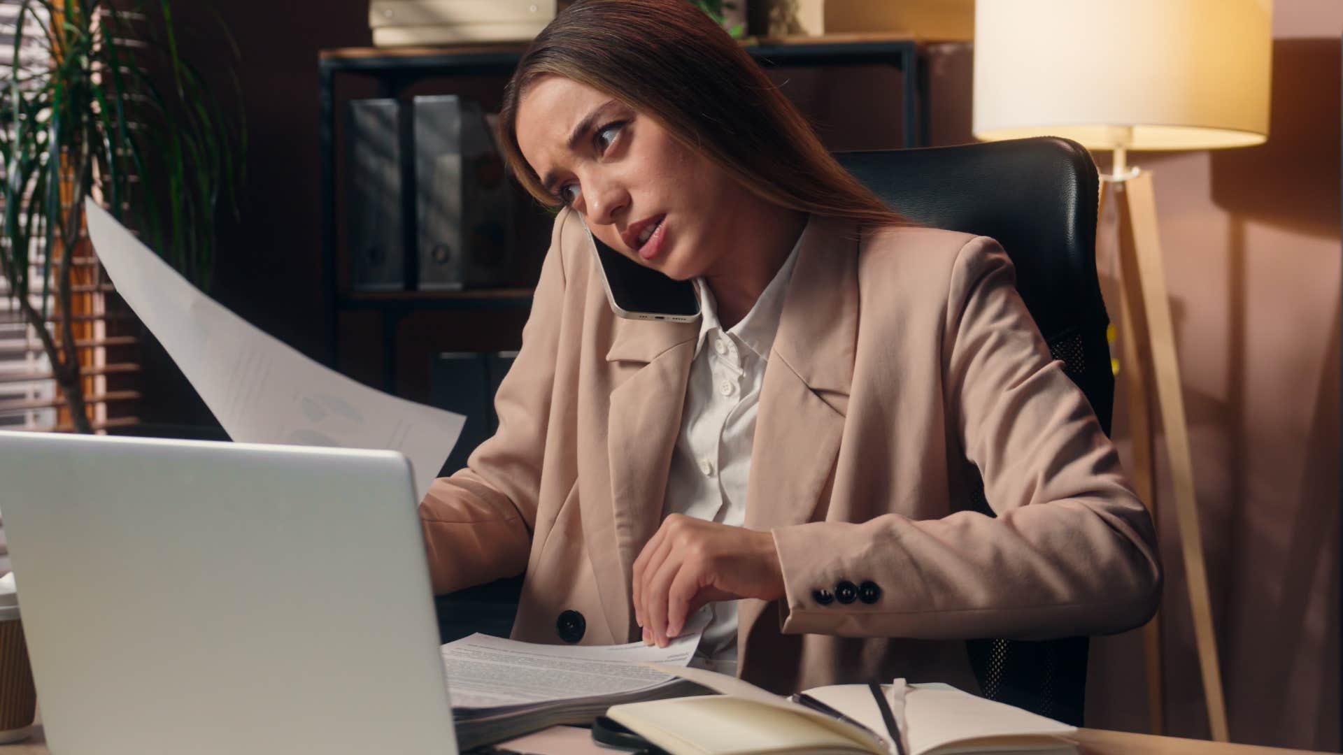 Woman saying "I'm so bad with money" doing bills.