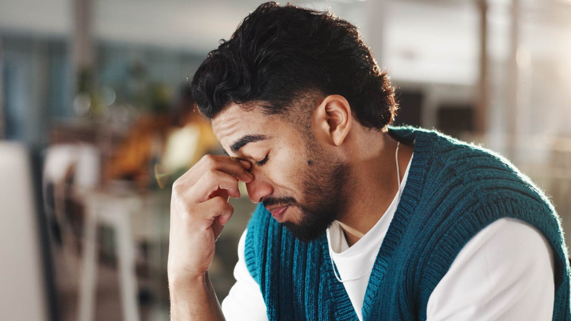 Upset man saying "they're judging me" at home.