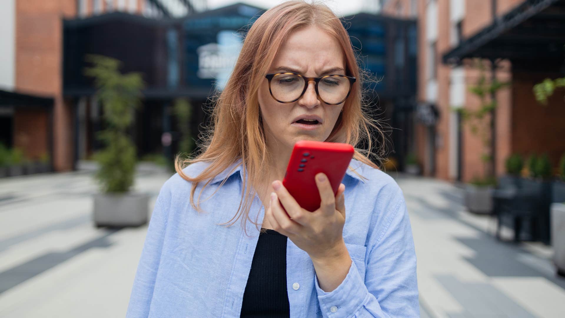 Woman saying "this is the worst day ever" on her phone.