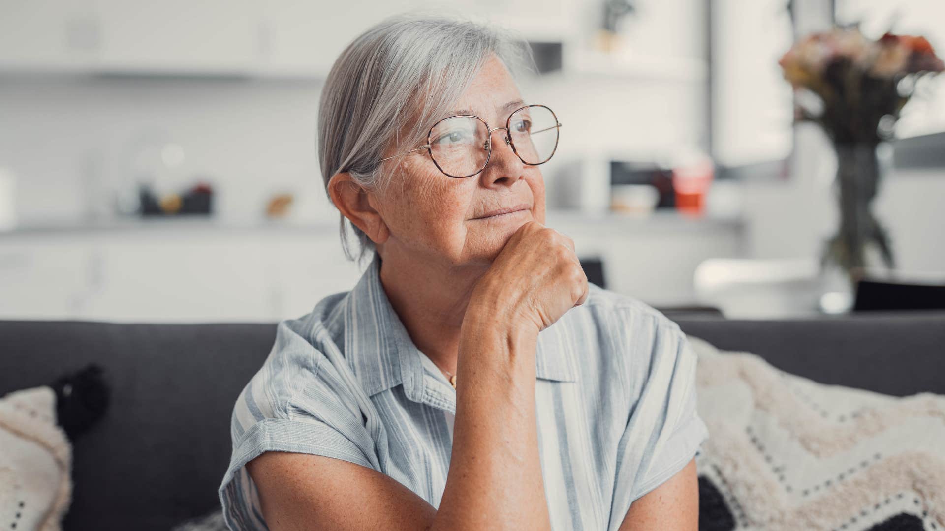 older southern woman thinking at home
