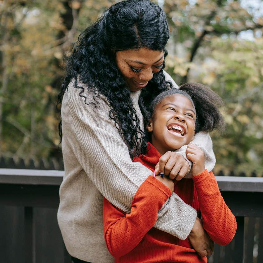 daughter who is happy because she feels loved by her mom