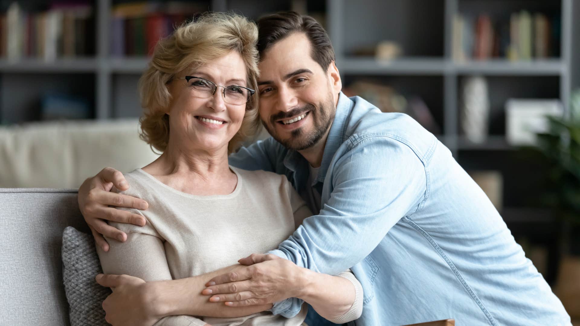 man expressing gratitude for his mom hugging her