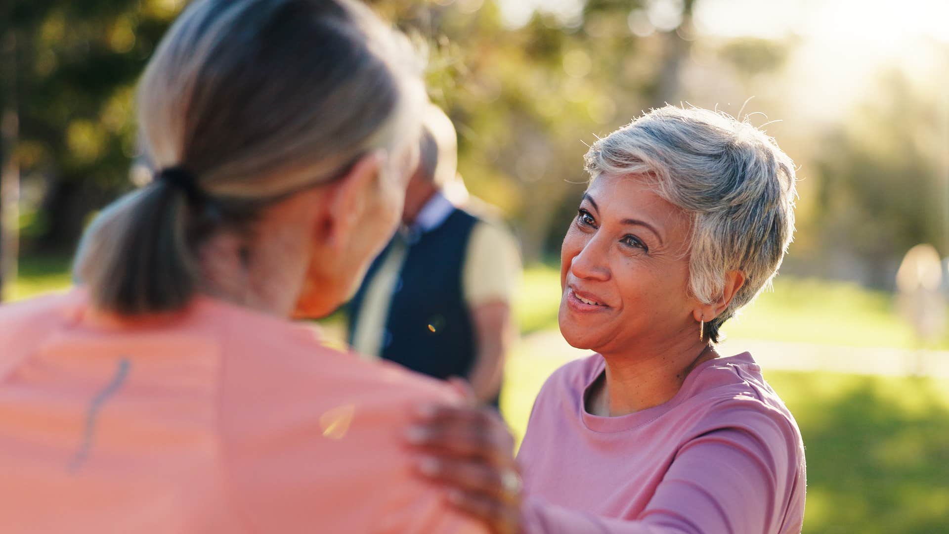 Aging person supports another showing no blame