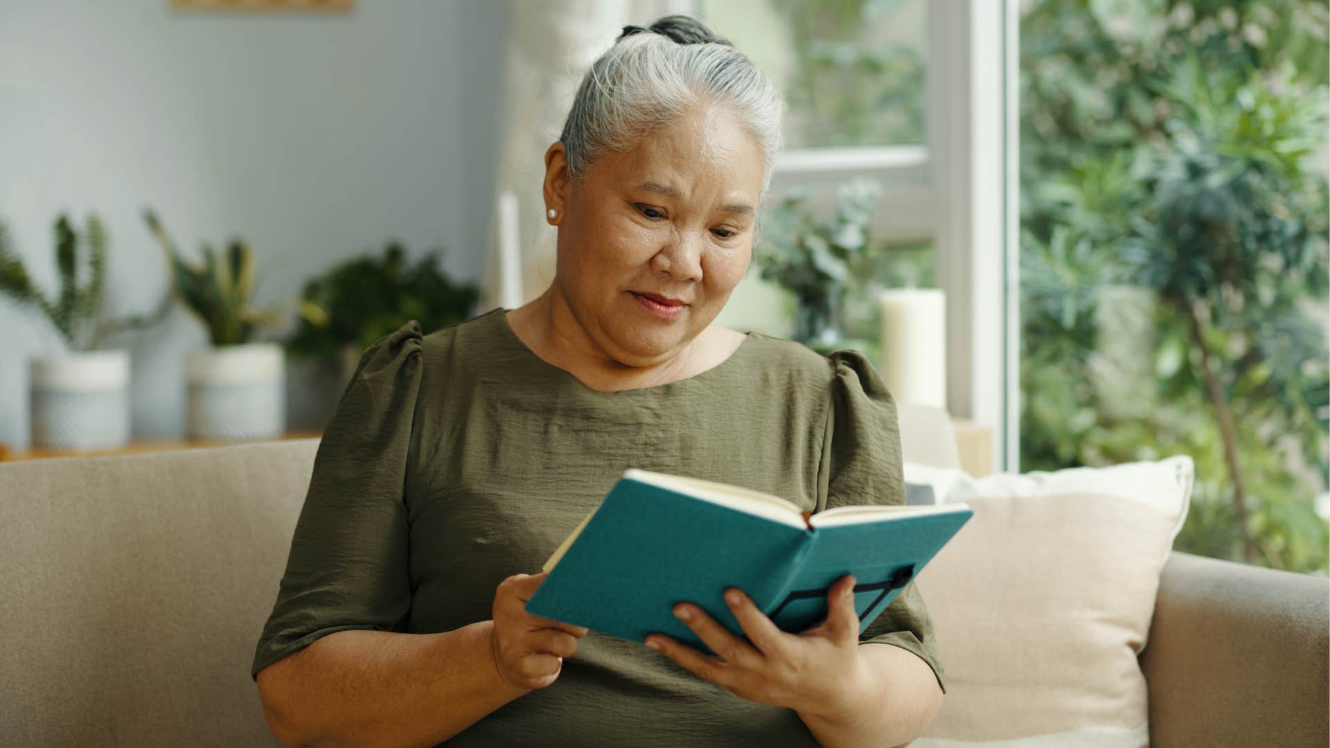 aging person reads book showing curiosity 
