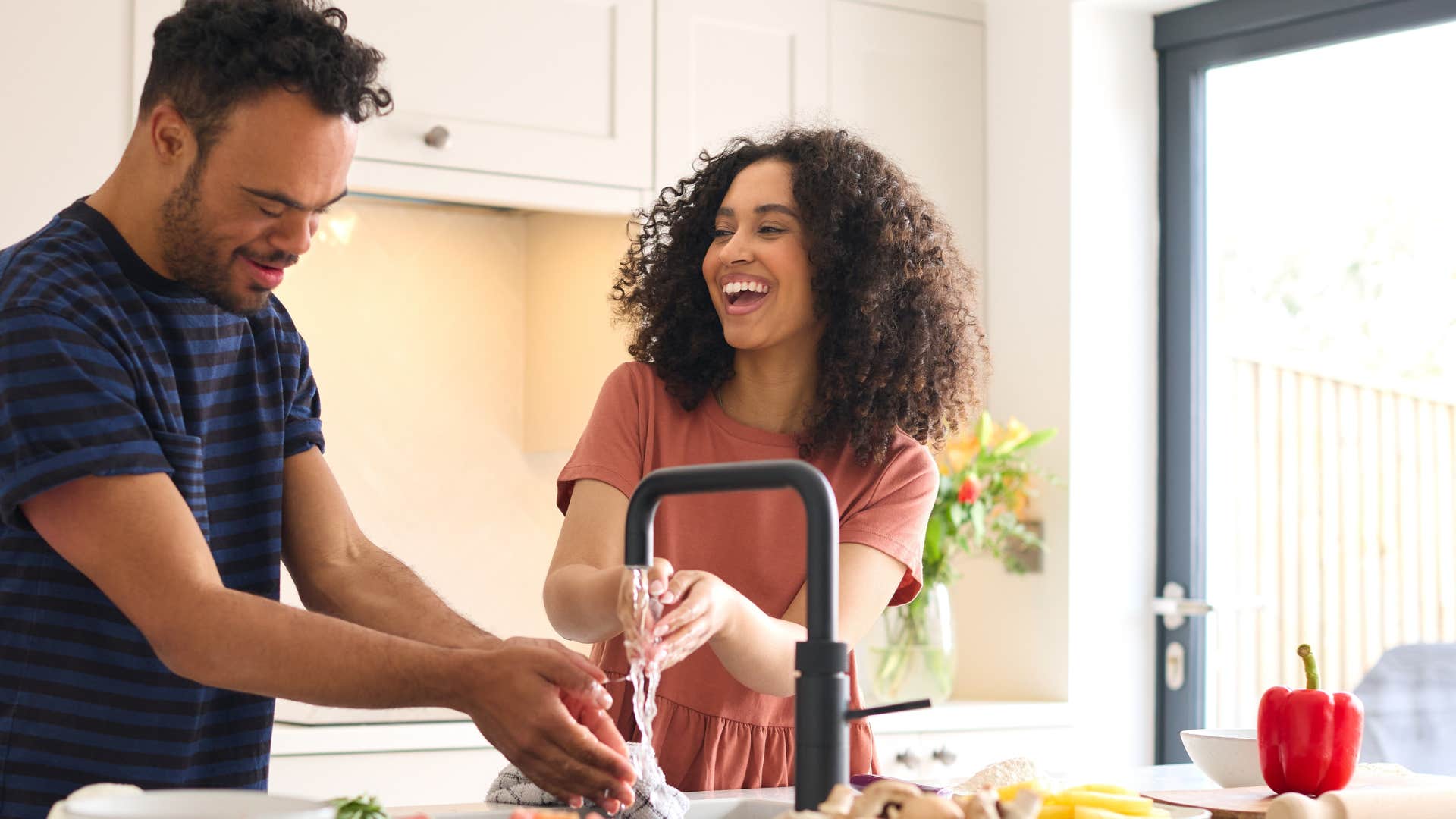 couple washing hands in sink taking for granted their access to clean water