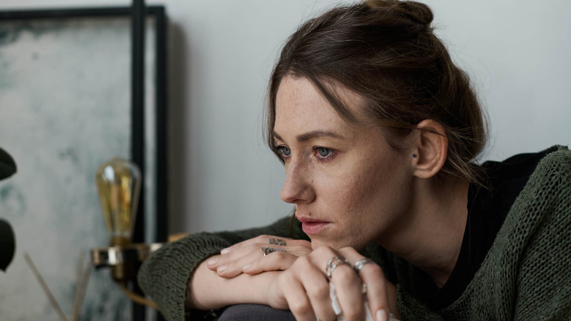 woman upset and alone as it feels safer not to get attached