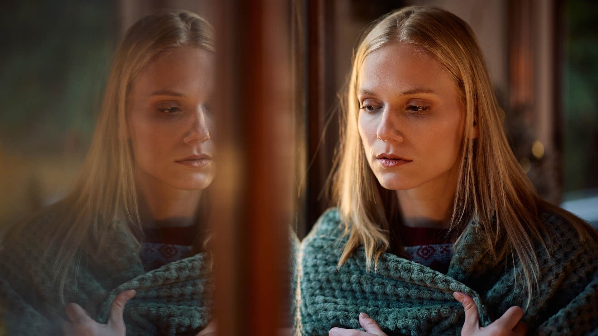 woman looking concerned as she's scared of losing everything again