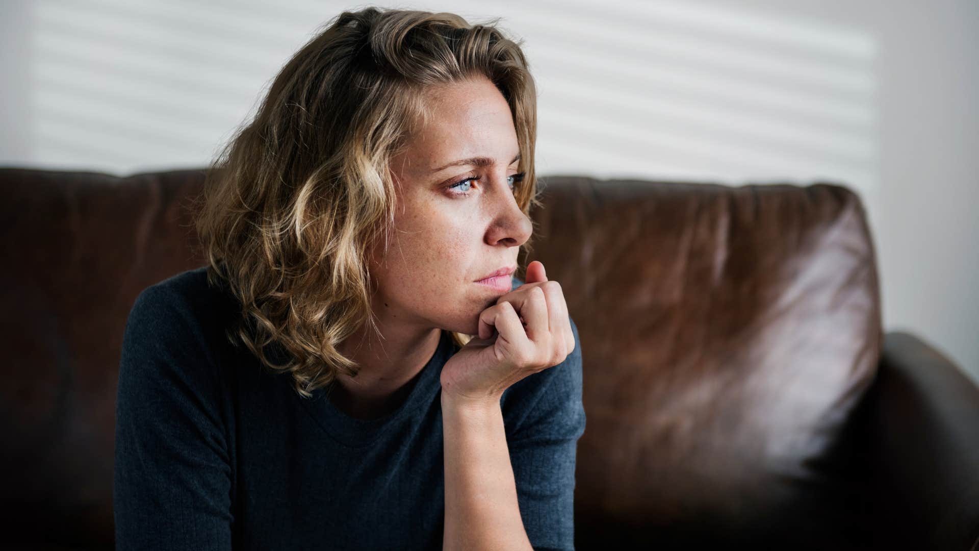 woman in blue shirt doesn't know how to feel safe