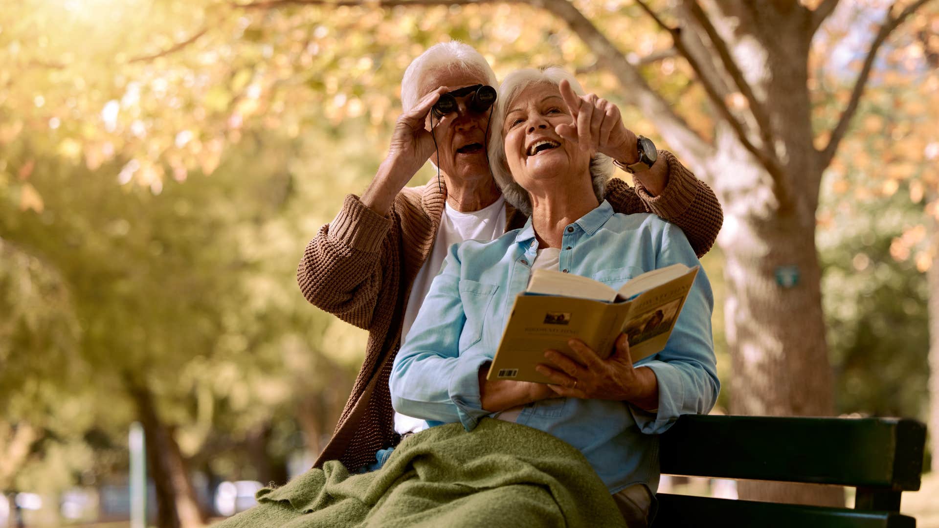 older couple bird watching showing you can meet someone new