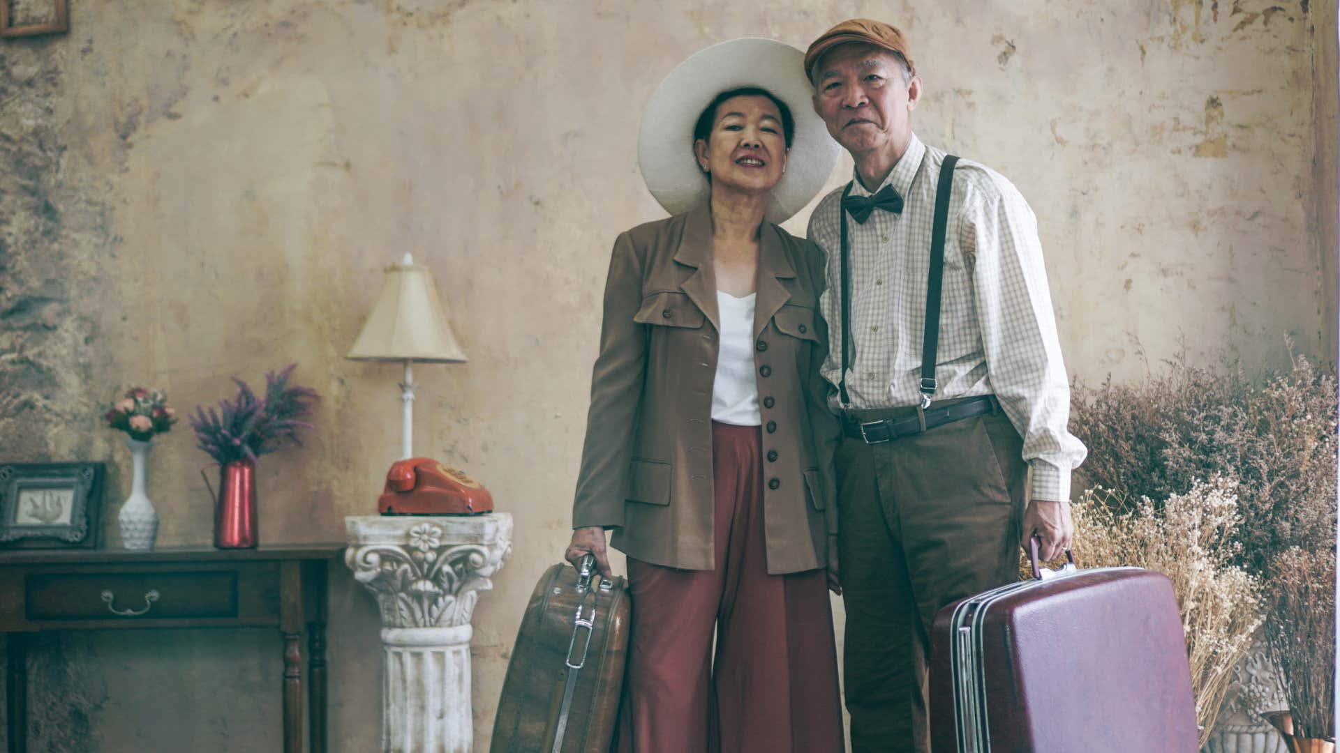 Older couple with suitcases ready to love travel