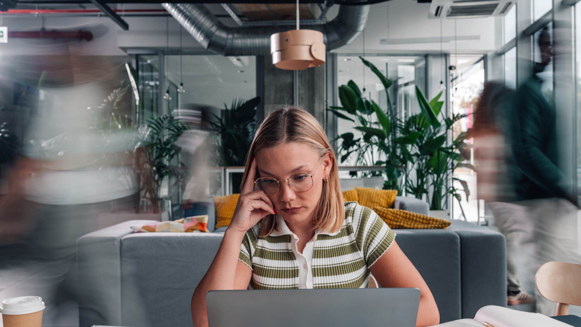 exhausted employee with no work-life balance sitting at desk