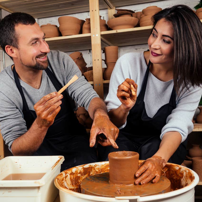 happily married couple taking a pottery class together