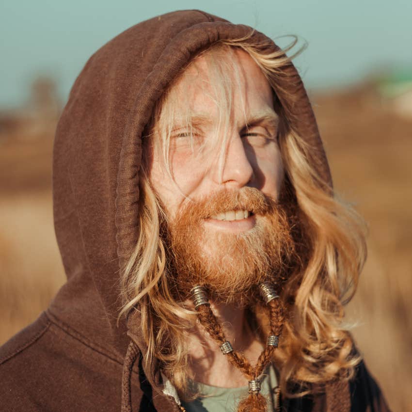 man with a beard protecting his face from skin cancer