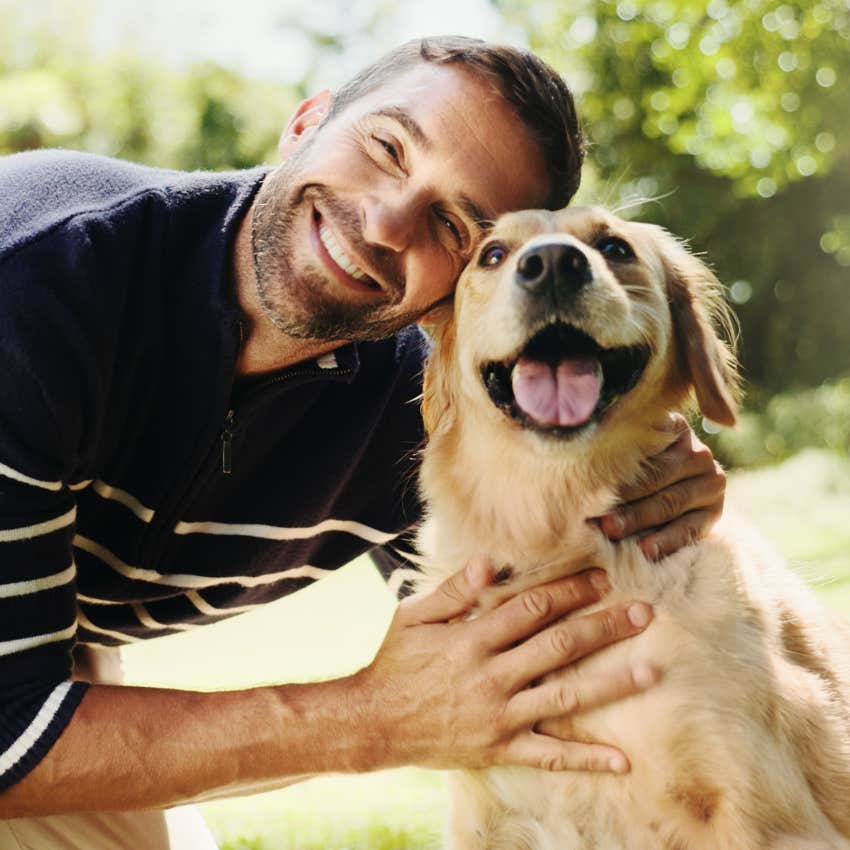 outgoing man smiling with his dog