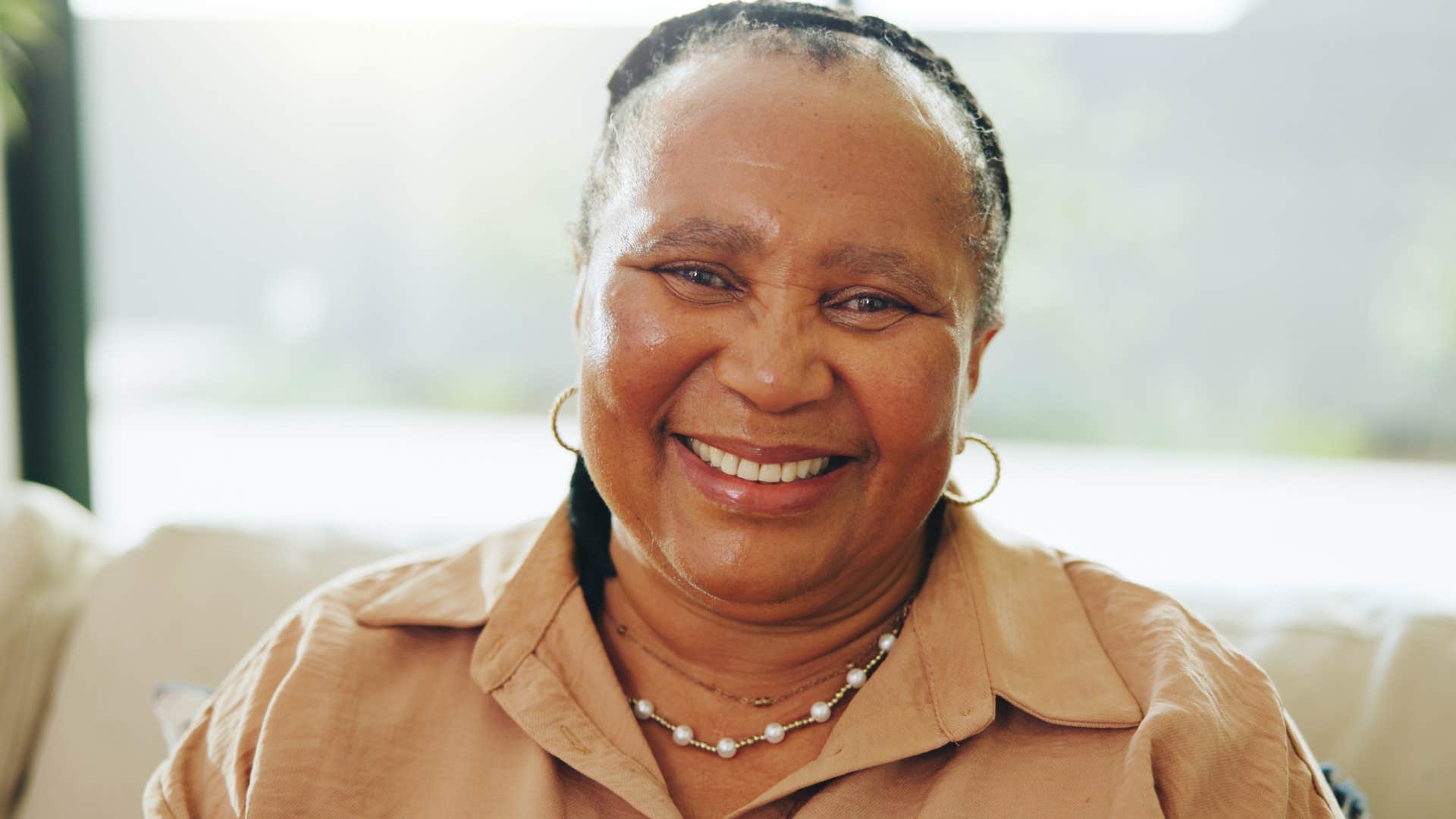 Woman who leads with their values sitting at home.