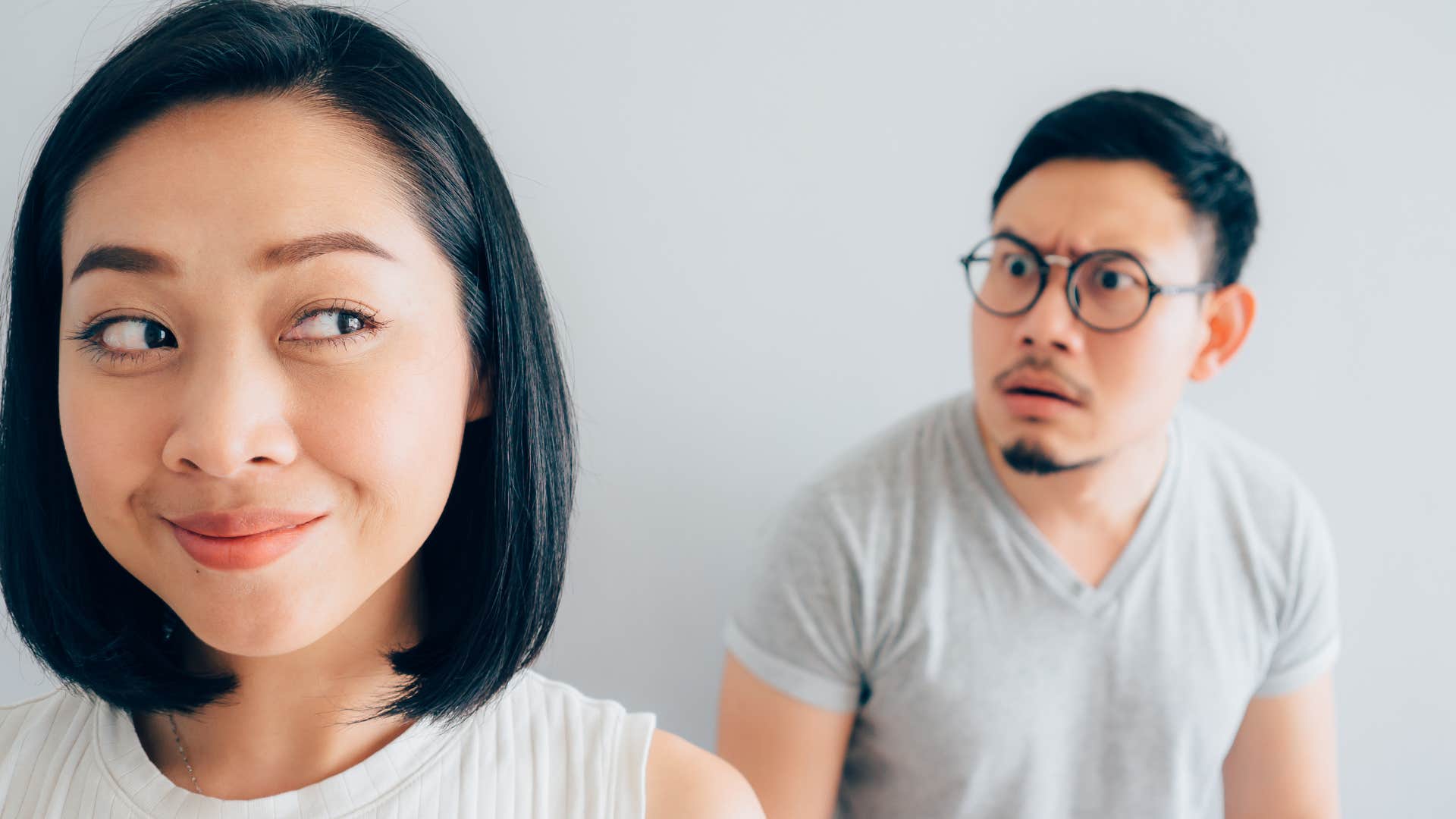 woman pretending to be nice but secretly lying about small things to partner