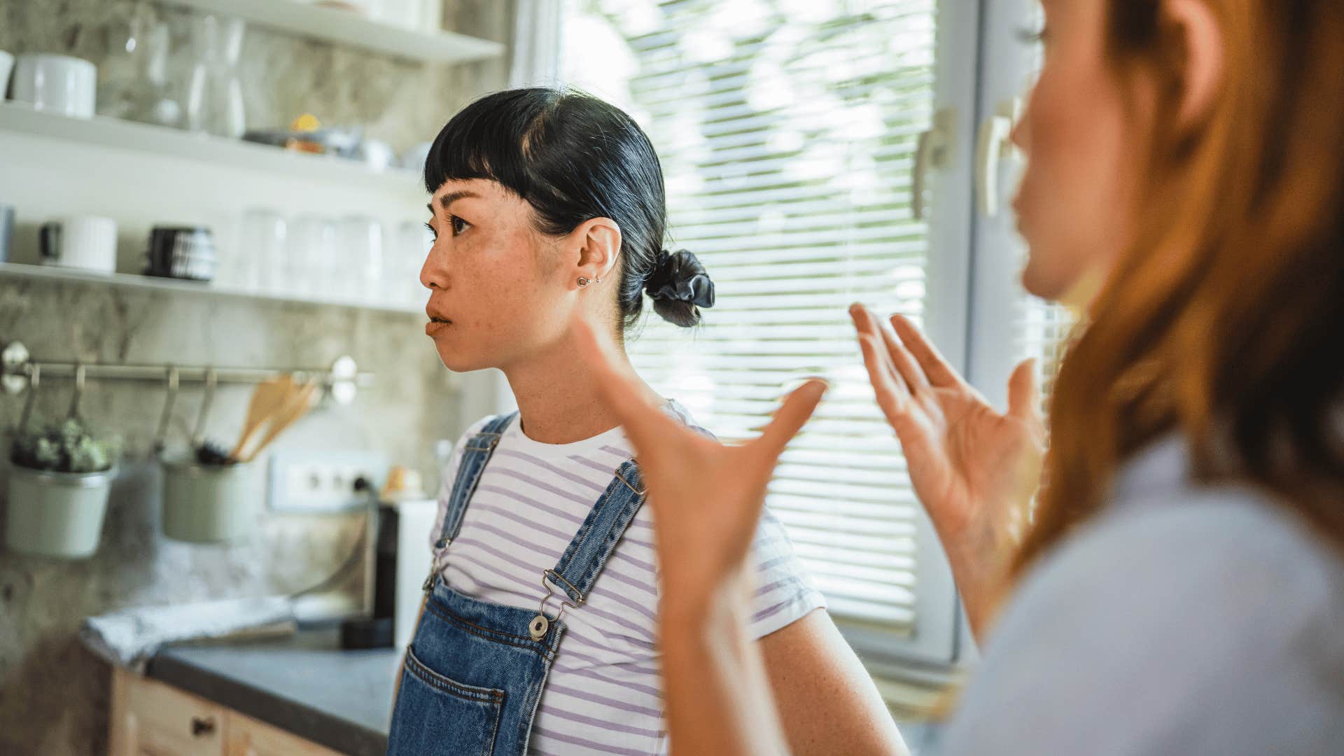 woman who is out to get other woman as she doesn't give genuine smiles