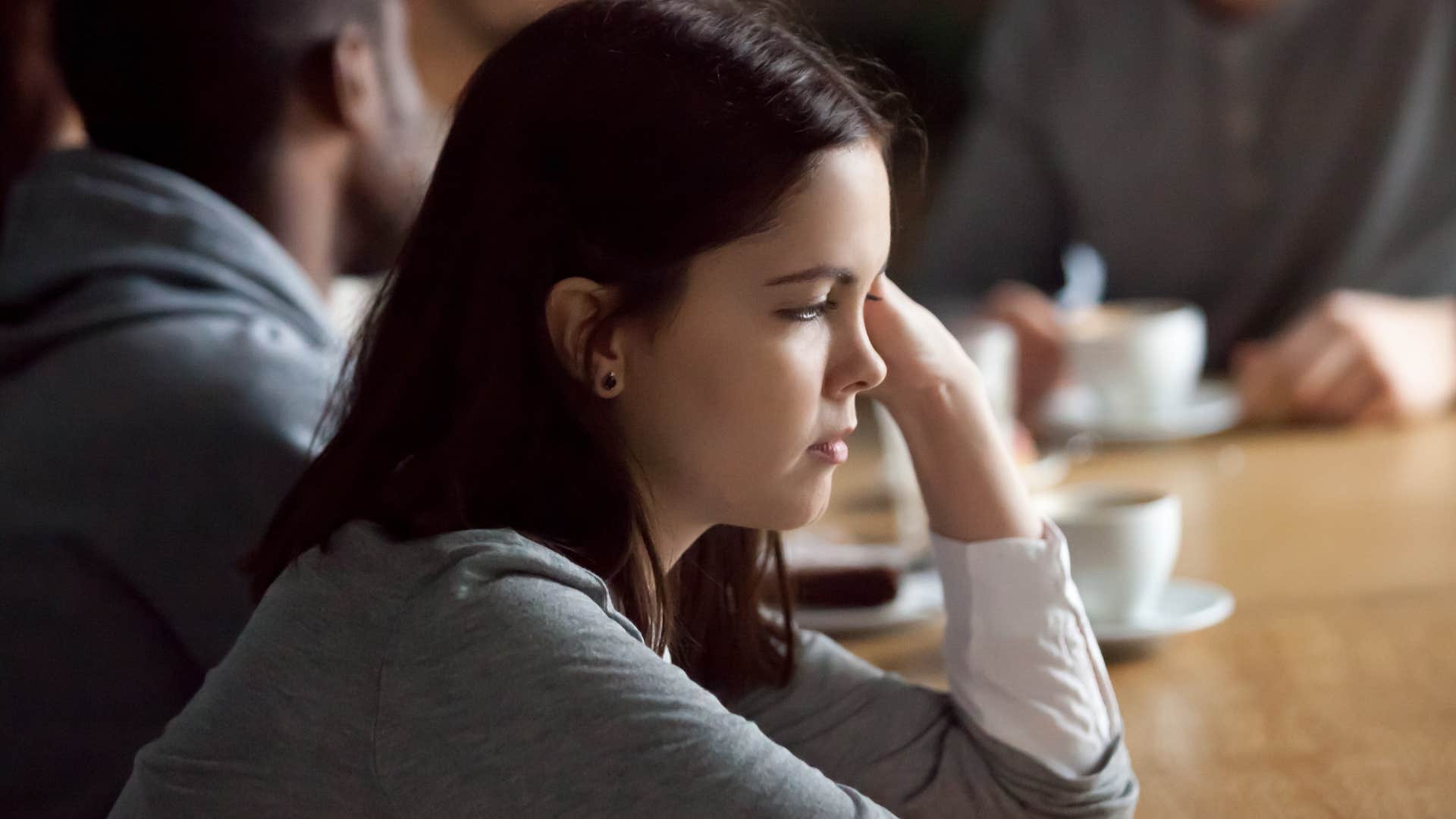 Woman who sometimes feels like a performer in social situations.