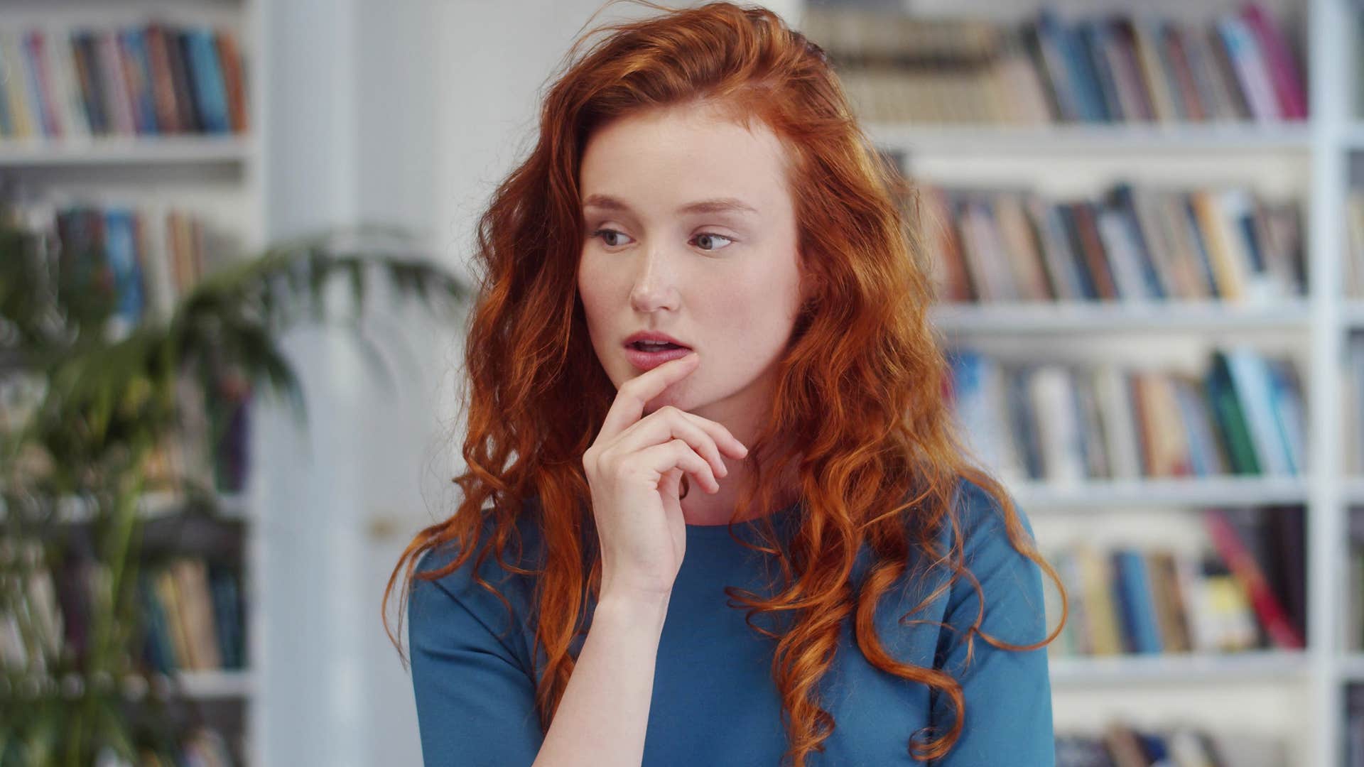 Woman with vibrant ideas and thoughts sitting at home.