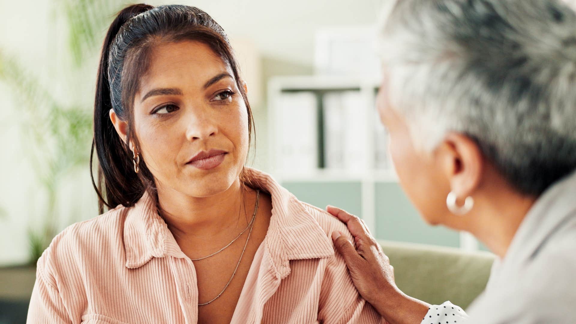 woman adopting the family mentality at work talking to boss