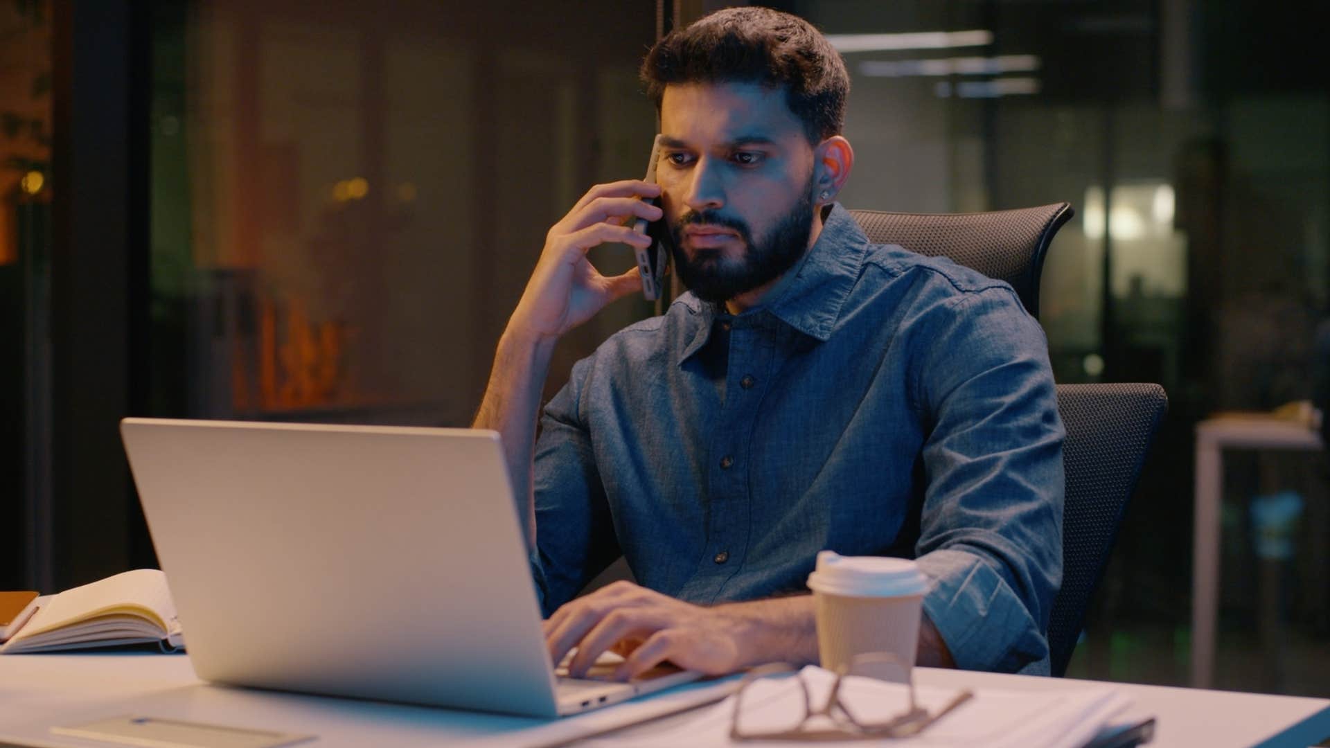 man reaching out to colleagues after working hours