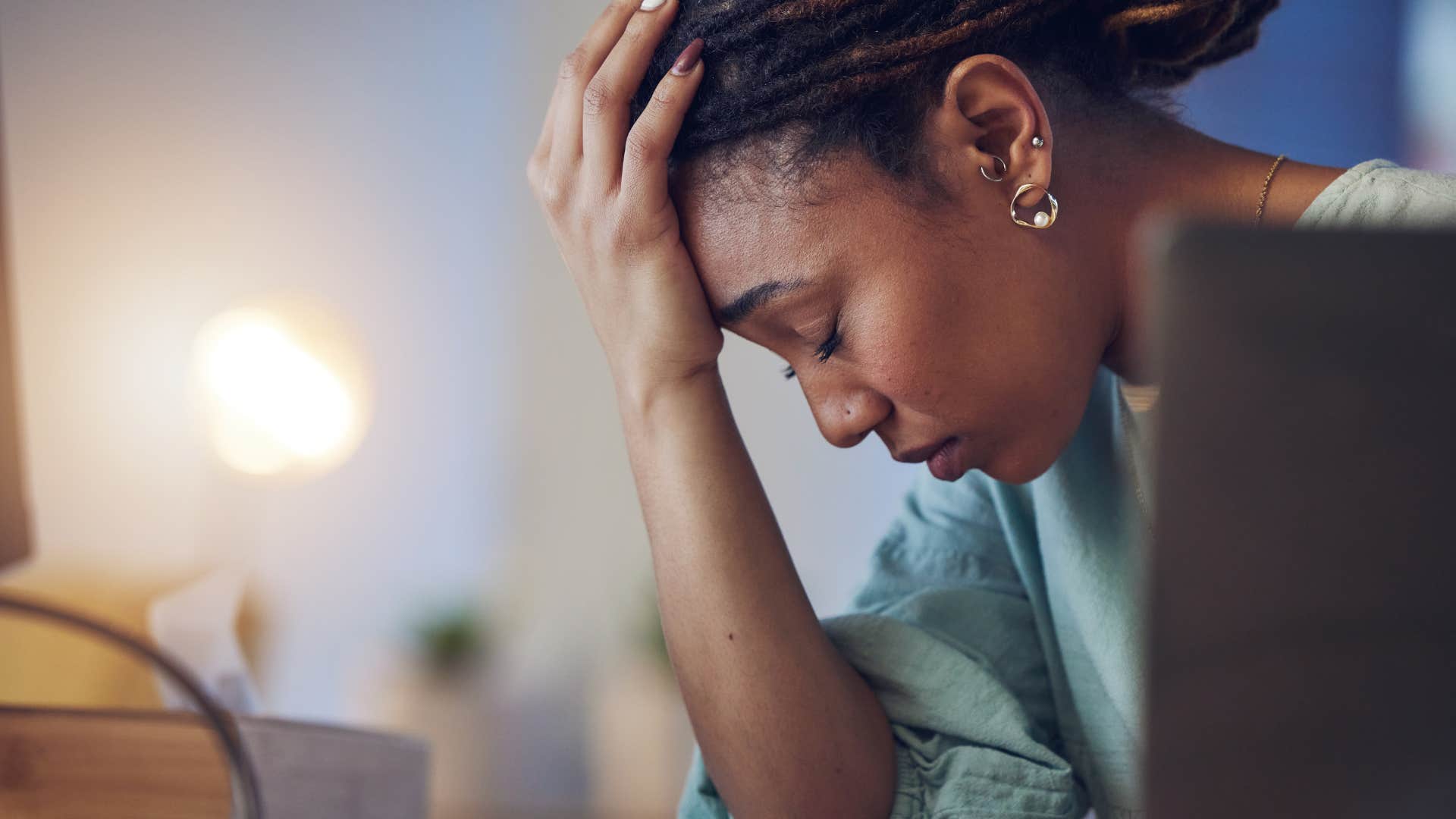 stressed woman who ties productivity to success at work