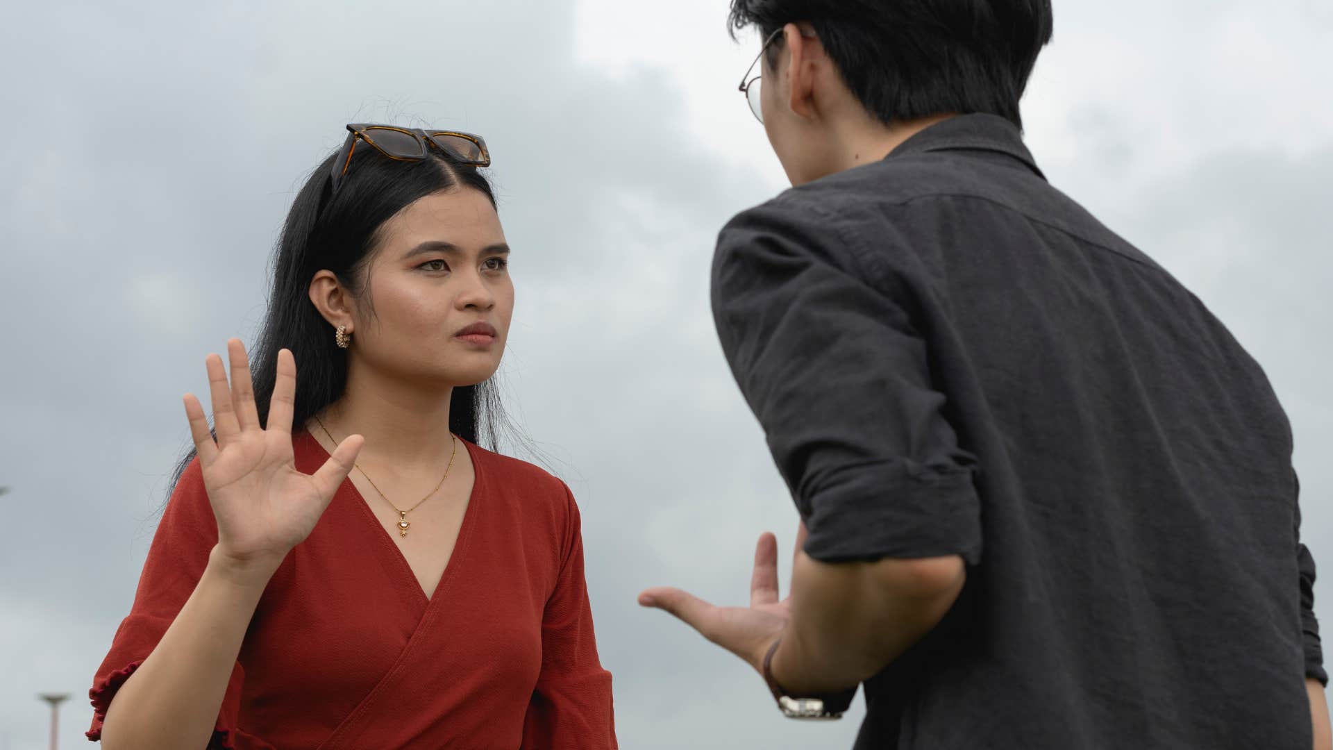 woman feeling frustrated by repetitive conversation with man