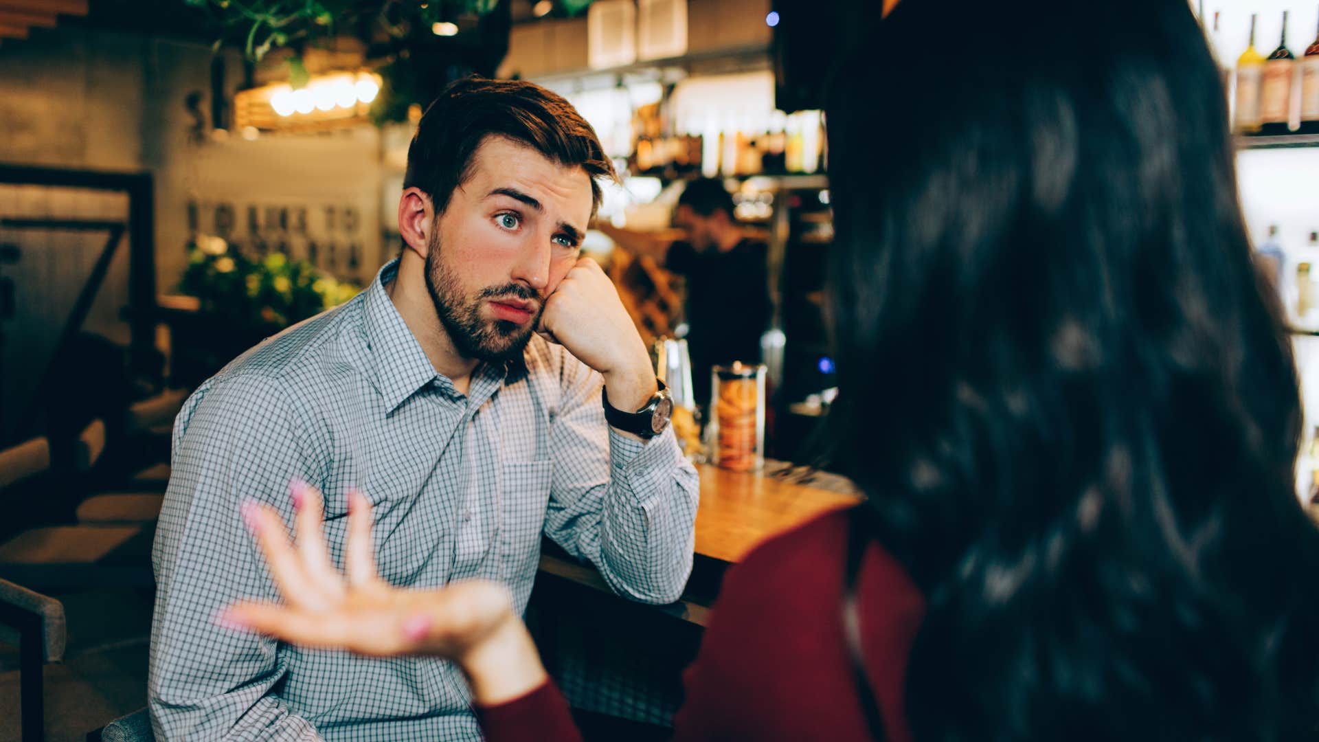 man feeling drained by small talk with woman