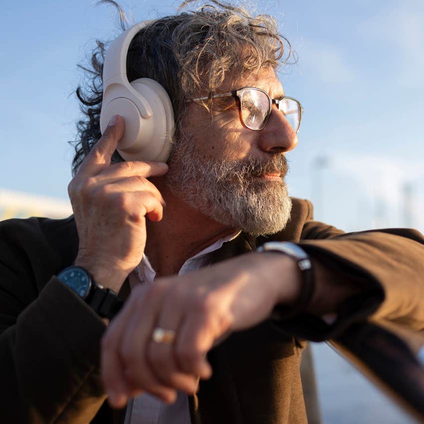 Man listening to rock music that makes him look attractive and hard to ignore