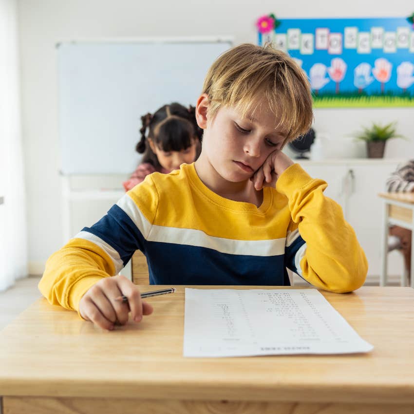 young boy struggling at school