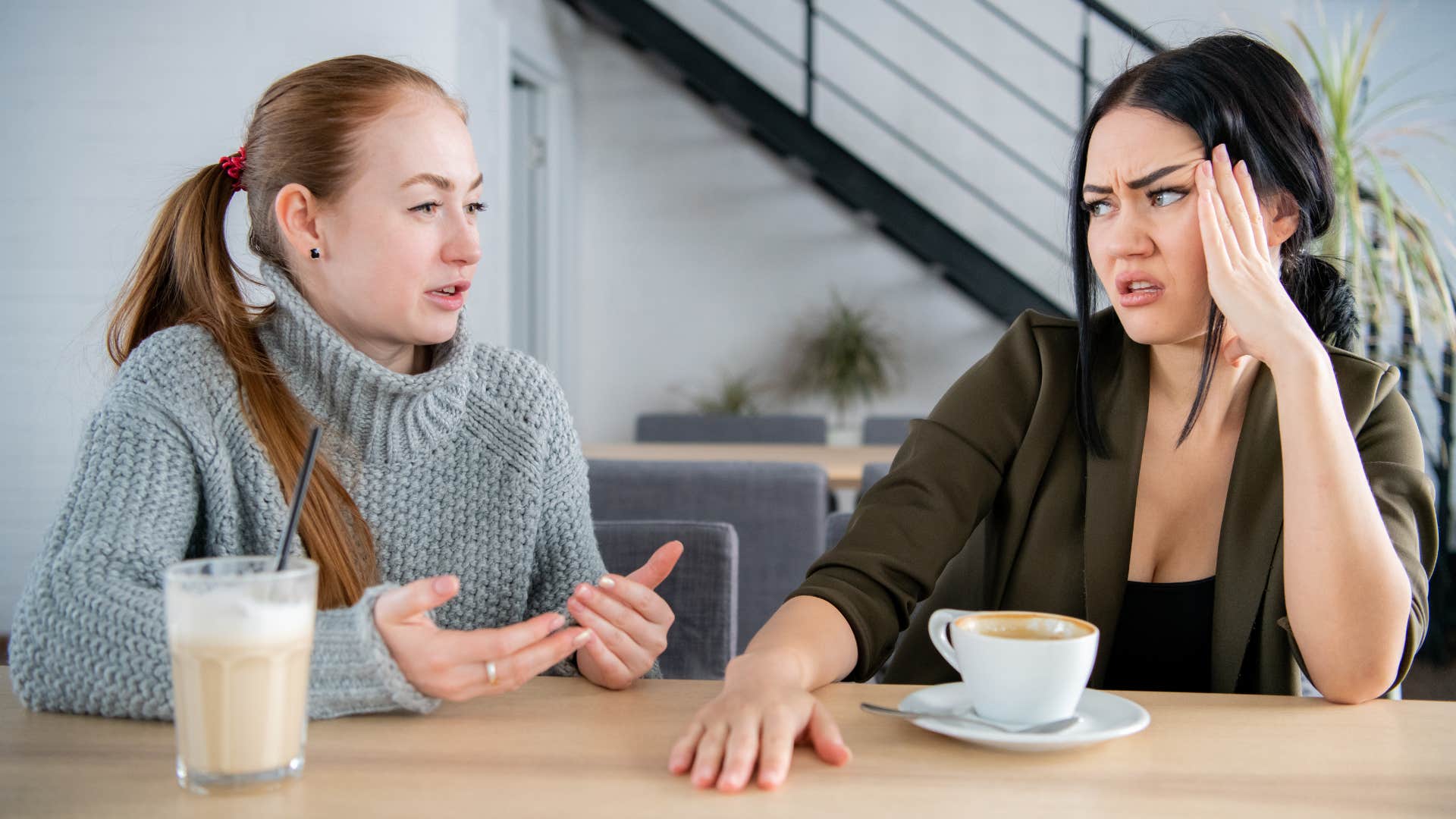 Someone who isn't a good friend making a face at her friend 