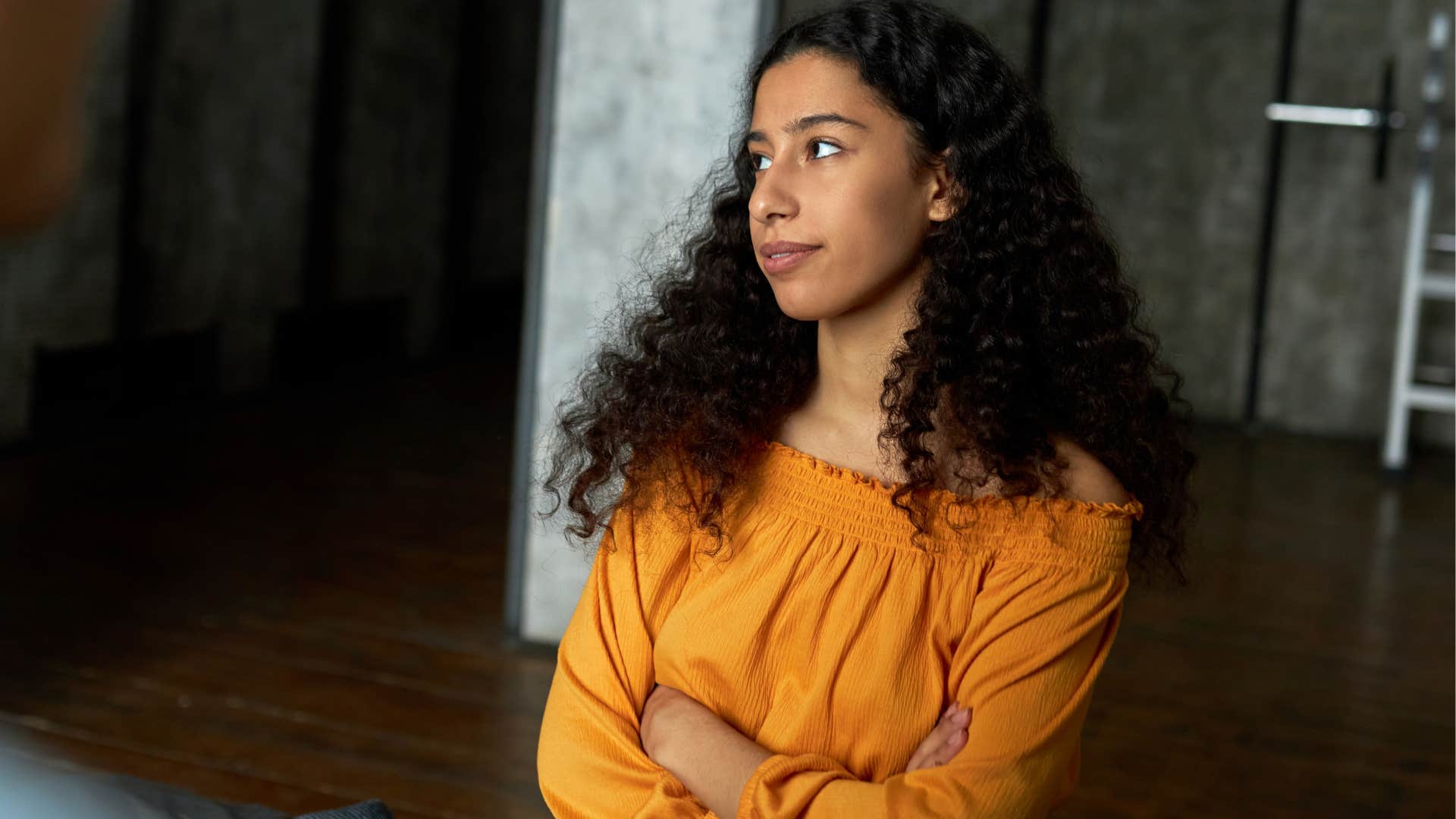 annoyed woman with arms cross saying it's not a big deal
