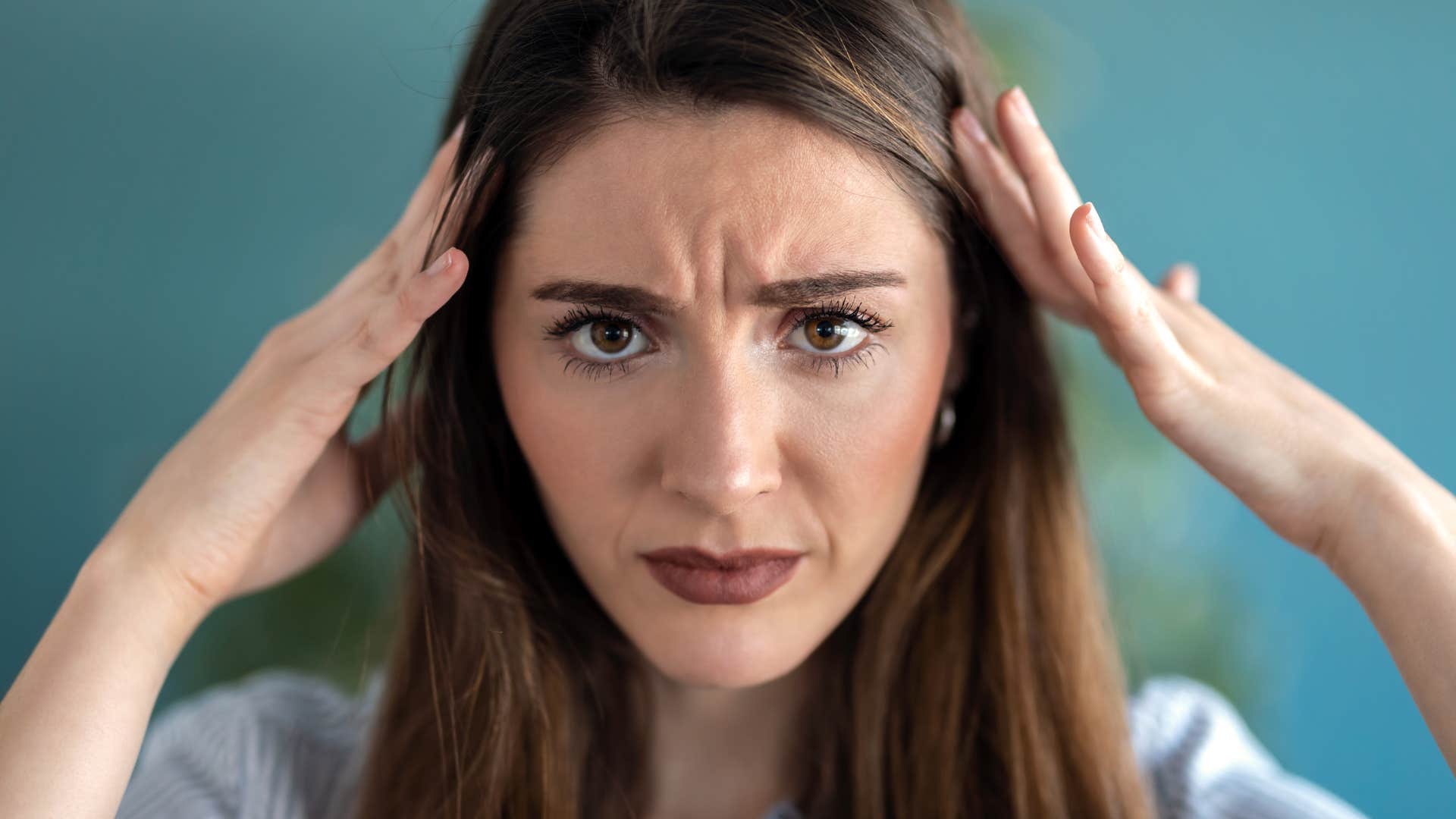 incredibly stressed woman shutting down emotionally