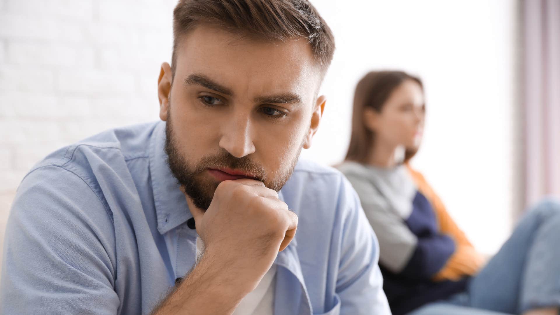 man feeling stressed thinking about his childhood