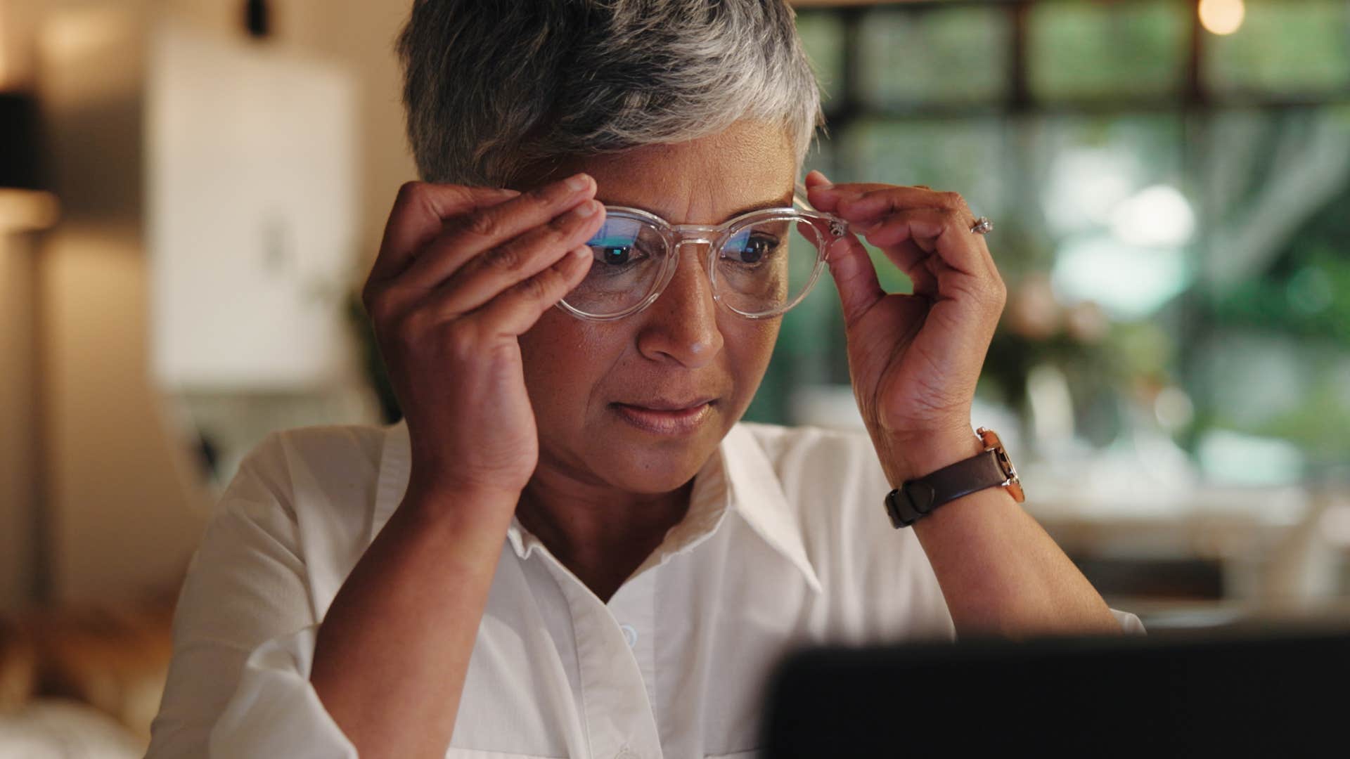 woman relying on busyness to distract herself at home