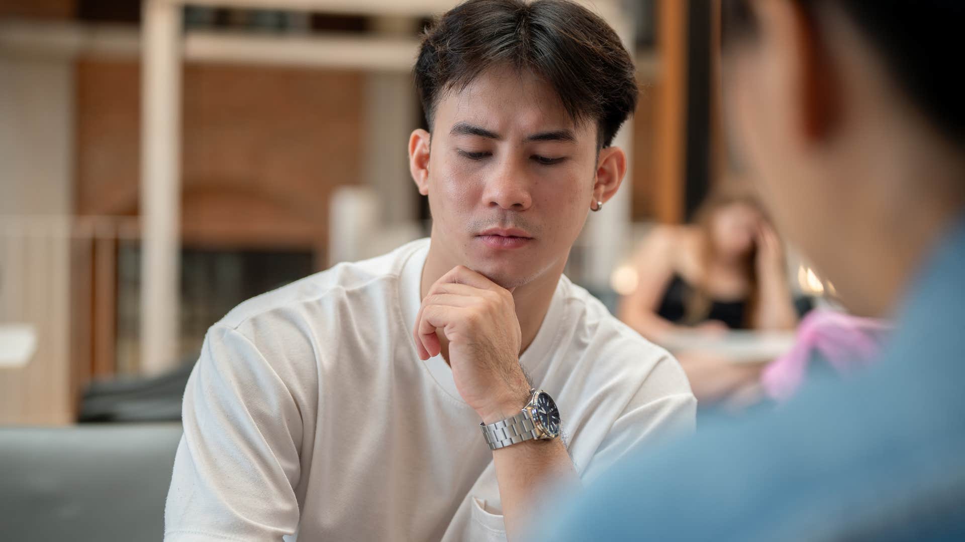 man struggling to verbalize how he feels to a friend