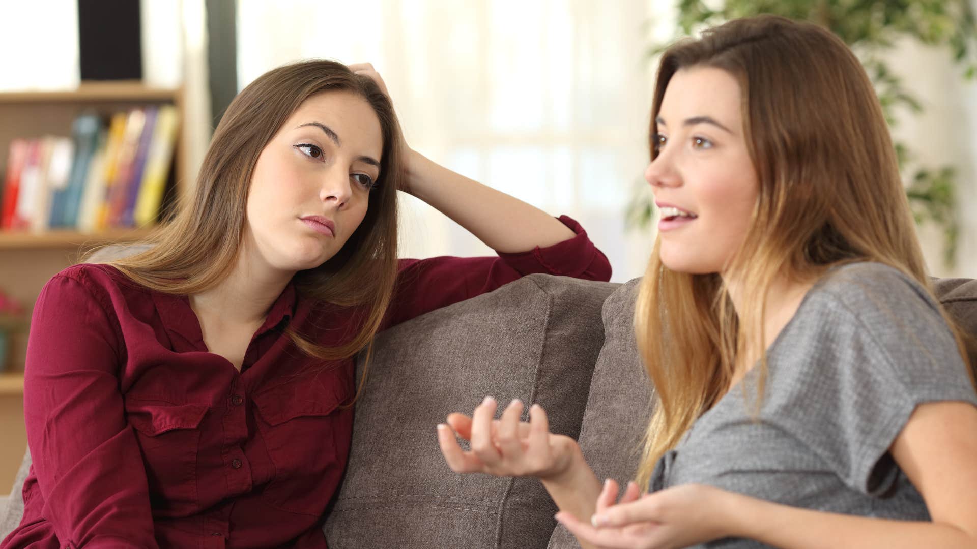friend in red listening as their stories are inconsistent 