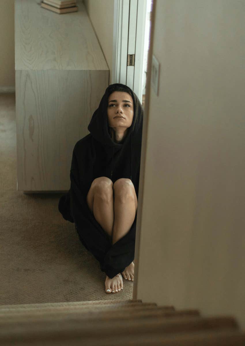 stressed out millennial sitting on the ground