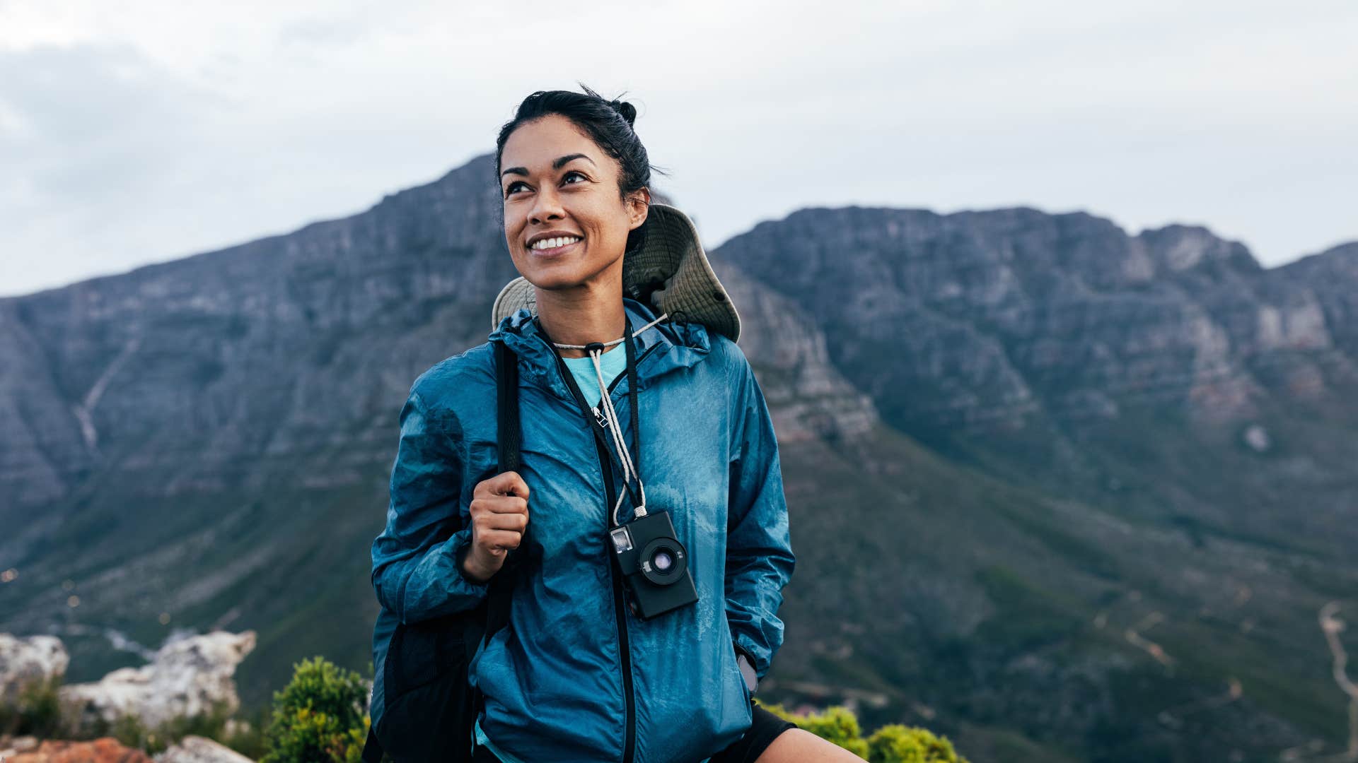 happy person with camera showing they weren't too bust to be spontaneous