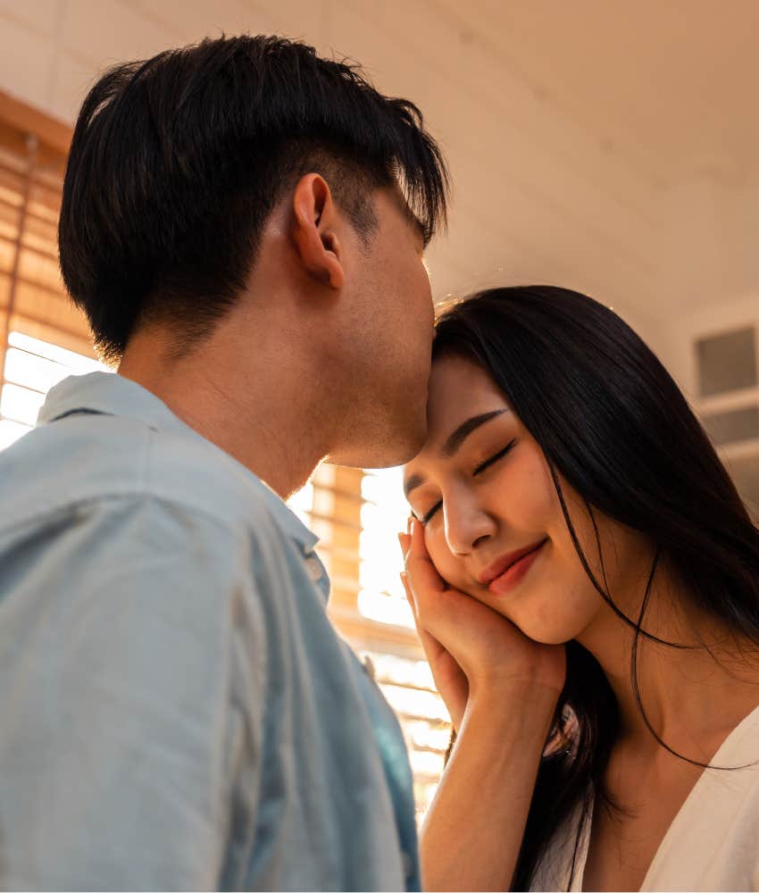 Loving couple share rare moment with a kiss