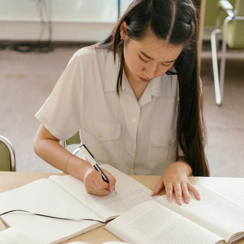 student working on her handwriting