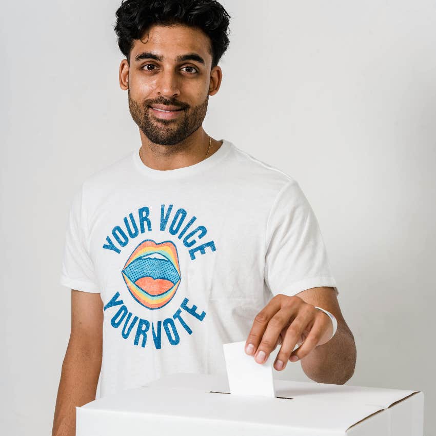 politically active young man casting his vote